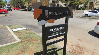 Photograph of custom entrance sign for Pinehurst Apartments in Oklahoma City - designed by Electremedia.