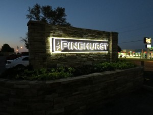 Photo of custom logo monument sign designed by Electremedia for Pinehurst Apartments in Oklahoma City.