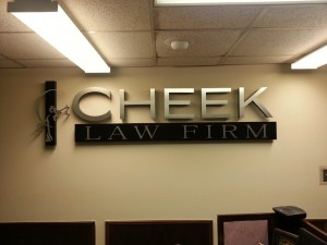 The custom logo sign designed for Cheek Law Firm installed.