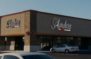 An image of the corner of the building with 3D rendering of signs superimposed.