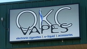 A picture of a new sign face for an e-cig store.