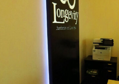 Halo and face illuminated lobby sign.