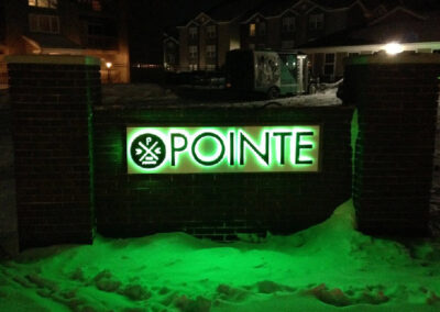 Halo and face illuminated specialty sign for The Pointe student apartment building.