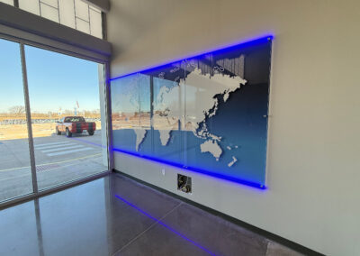 Angle photo of an illuminated acrylic wall display.