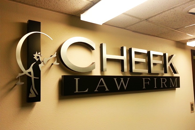 Photo of interior wall logo sign for lobby and reception area.