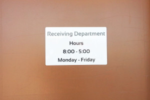 Photo of door sign that says receiving.
