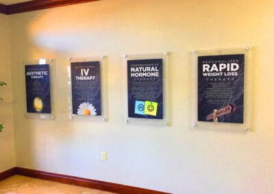 A photo of acrylic wall posters in a lobby.